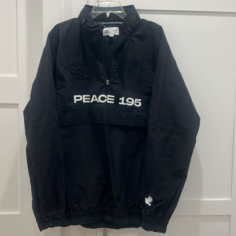 Umbro x Akomplice world peace quarter zip windbreaker